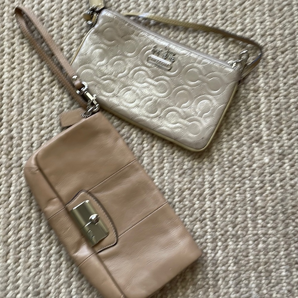 Two Coach wristlets.